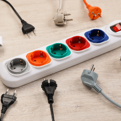 "Extension board with charging points on all four sides, featuring multiple sockets for various devices."